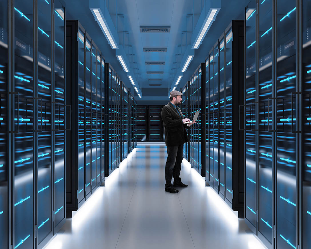 Reliability &ndash; A man checks server function on a laptop